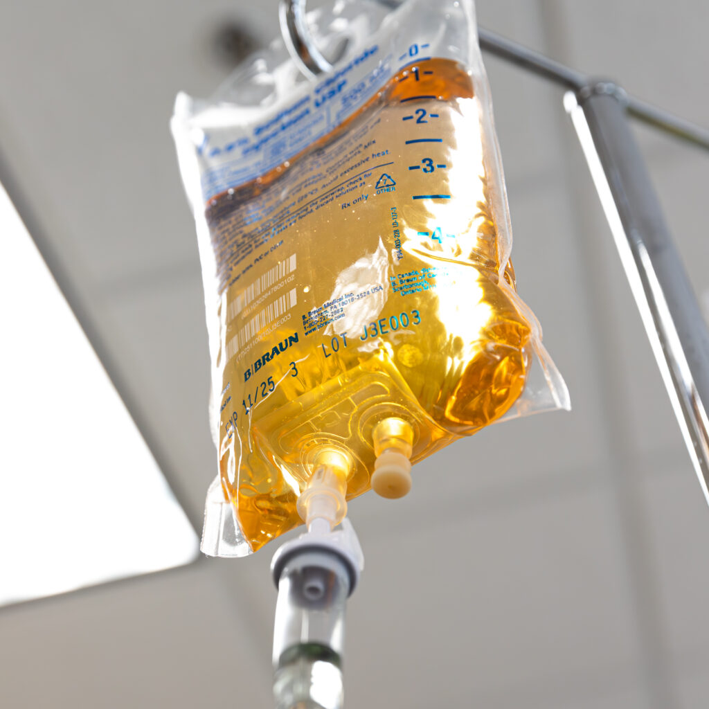 Bag of hydration IV Therapy in Leesburg hainging in a med spa attached to a hook.