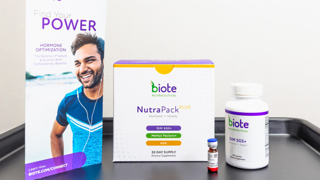 Informational pamphlet, bottle of supplements and bottle sitting on a counter. Each product is from Biote, a brand that offers bio-identical hormone replacement therapy near The Villages