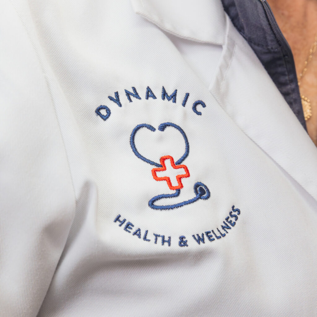 Photo of lab coat with 'Dynamic Health & Wellness' embroidered on it to indicate that this med spa offers health care services in Leesburg